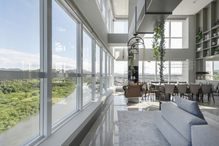 Apartamento duplex integra vibe cosmopolita com vista para a natureza